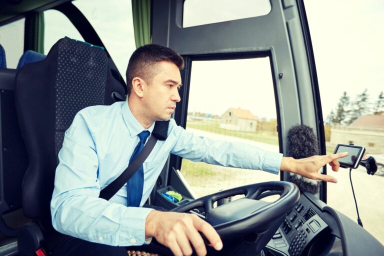 bus driver entering address to gps navigator