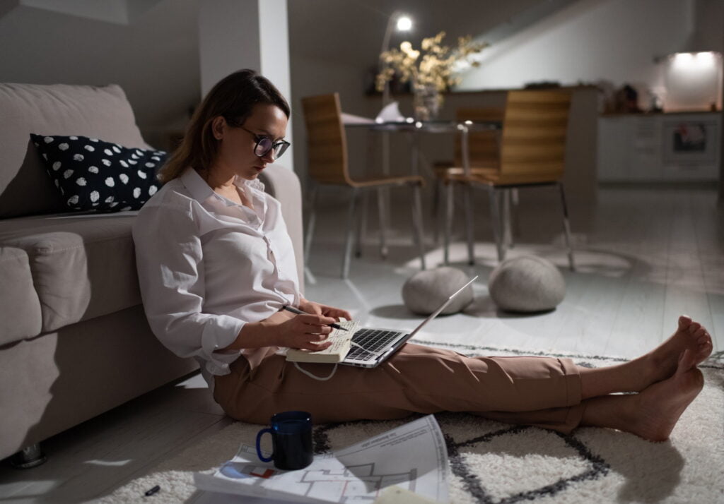 Busy woman working remotely from home