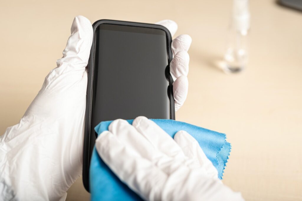 Cleaning smartphone with disinfectant