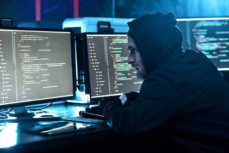 Computer hacker breaking the software