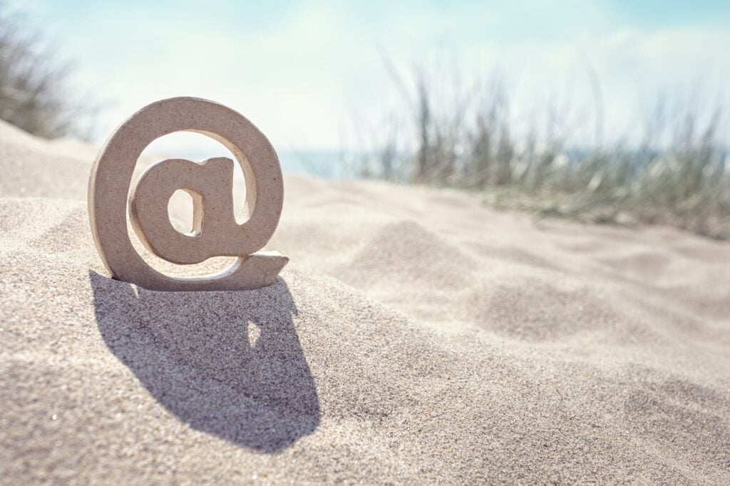 E-mail @ symbol at the beach
