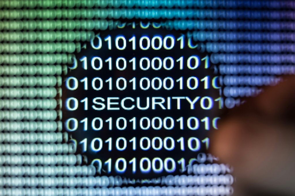 Word security written in binary code with magnifying glass - optical character recognition - ocr in cybersecurity